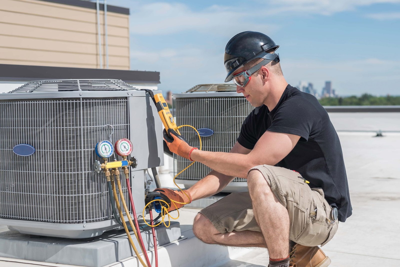 HVAC technician repairing air conditioner