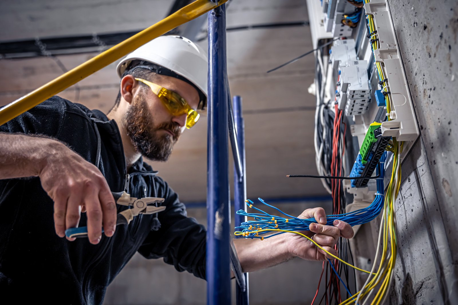 Electrician working on panel